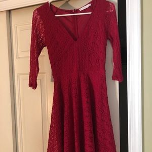 Mini red lace dress with a v-neck and 3/4 sleeves